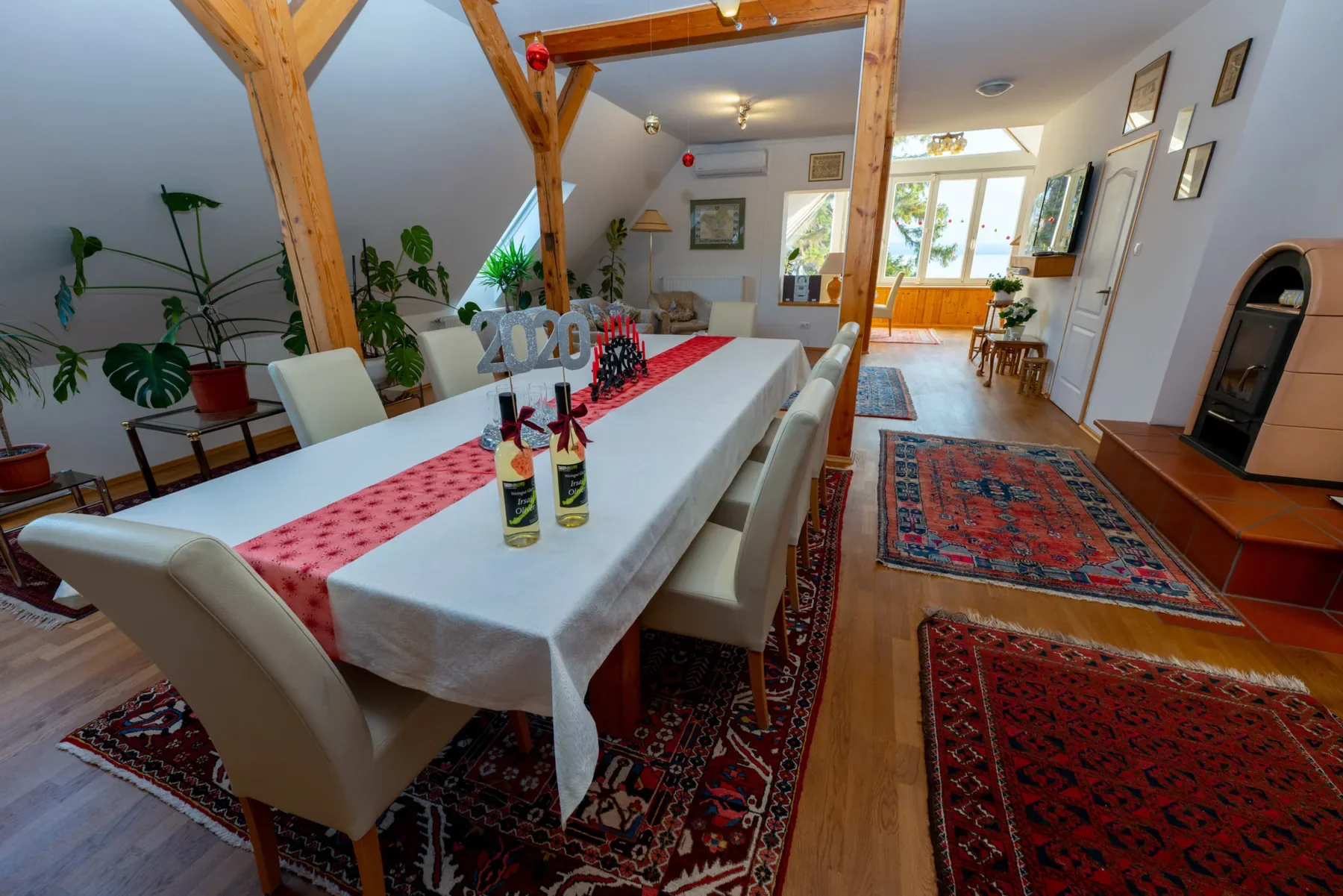 Large living and dining area in Apartment Modern with wooden beams and long dining table